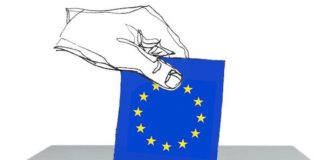 Disegno di una mano che inserisce bandiera dell'Europa nell'urna